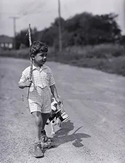 Boy Walking with Fishing Stick
