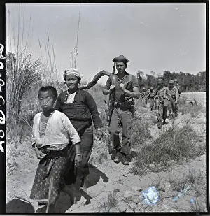 Natives Prints: Boy, Woman In Front Of Line Of Troops