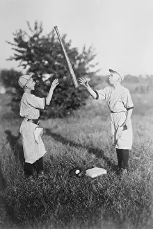 Catching Prints: Two boys (10-12 years) playing with baseball bat. April 05, 1922