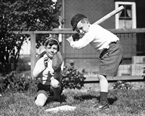 Exterior Space Prints: Two boys (6-7) playing baseball in garden, (B&W)