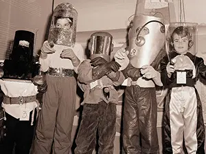 Modeling Prints: Boys Act Tough and Model Their Spacesuits