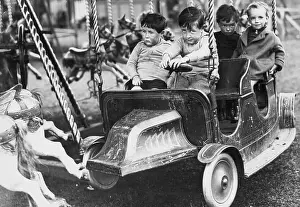 Boys on Carousel Car