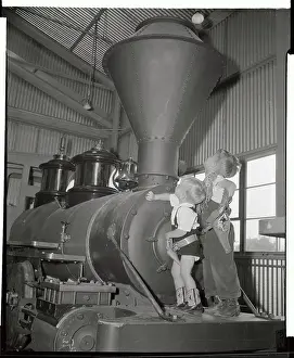 Boys Climbing on Disneyland Steam Locomotive