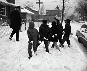 Hiding Prints: Boys Hiding Snowballs