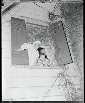 Prints of (Original Caption) Twas the night before Christmas when all through the house, sleeping though they were through this classic poem A Timeless Christmas: Vintage Treasures: Three Boys Looking Out a Window