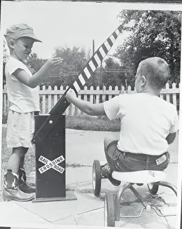 Optimism Prints: Boys with Makeshift Railroad Crossing Model
