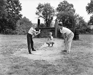 Three Boys Playing Sandlot Baseball