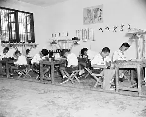 Making Prints: Boys Seated At Tables Making Shoes