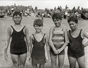 Clay Prints: Boys Stand Smeared with Clay on Beach