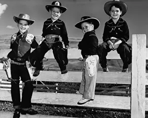 Chaps Prints: Boys Wearing Cowboy Outfits on Fence