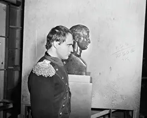 Prints of (Original Caption) 8/22/1954-Hollywood, CA: Marlon Brando, who's portraying Napoleon Bonaparte for the movie Desiree The Iconic Moments Captured: Brando In Front Of Napoleon Bust; Profil
