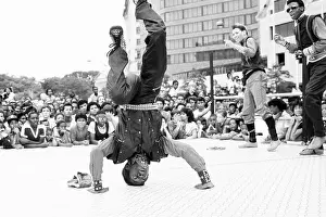 Breakdancer Performing in Front of Crowd