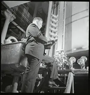 Real People Prints: Brewmaster Alfred W. Bowman Checking Tanks