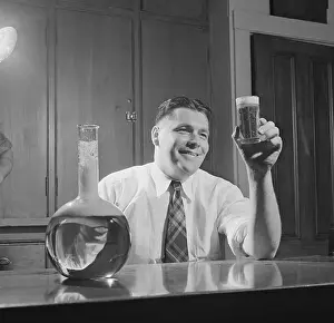 Real People Prints: Brewmaster Alfred W. Bowman Holding up Glass of Beer