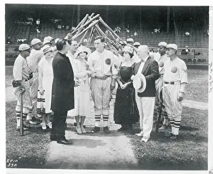 Bride and Groom Passing Under Arched Bats