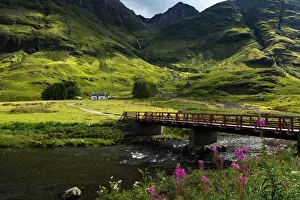 Bridge crossing the river Coe to cottage at Glencoe Highlands, Scotland