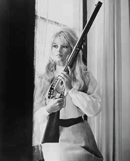 Brigitte Bardot Holding Gun