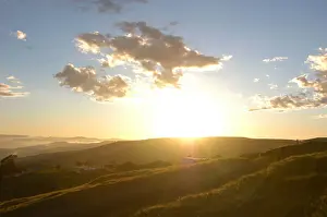 Photograp Prints: Brilliant sun shine and clouds over green hills in Coffee Bay, Eastern Cape, South Africa
