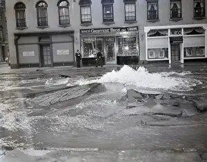 Main Prints: Broken Pavement Awash W/Water On Street