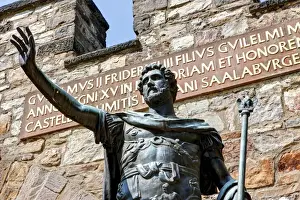 Emperor Prints: Bronze statue of Augustus the Roman emperor at the entrance of the reconstructed Saalburg the Roman fort