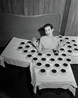 Brooke Robin Surrounded by Coffee Cups