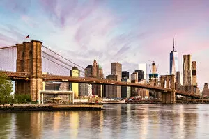 East River Collection: Brooklyn bridge and lower Manhattan skyline at sunrise