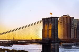 Brooklyn Bridge and Manhattan skyline at sunset, New York City, NY, United States