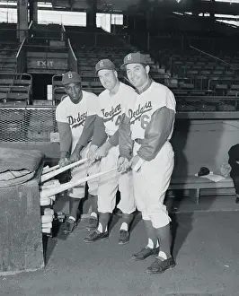Brooklyn Dodgers Grabbing Baseball Bats