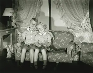 Miniature Prints: Brother and sister (4-5) posing in room, (B&W), portrait