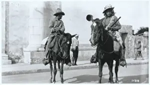 Brother and Sister Riding Atop Horses