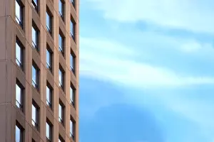 Brown Office Building and Clouds