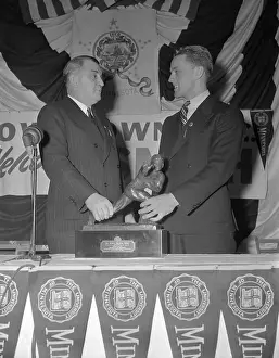 Bruce Smith Standing at Podium with Joseph R. Taylor