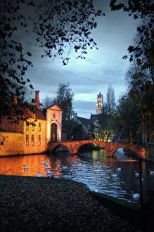 Bruges canal, swans, bridge and Belfry Cathedral