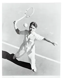 Bryan M. Grant Swinging With Tennis Racket