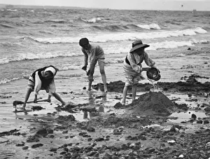 Prints of circa 1890: A group of children playing on the beach with a bucket and spades. (Photo by F J Mortimer/Getty Images) Francis James Mortimer (1874-1944) Prints: Bucket And Spades