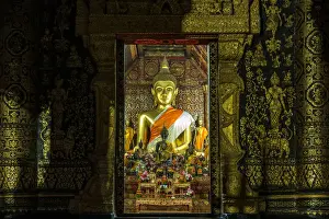 Luang Prabang Prints: Buddha statue in Wat Xieng Thong, Buddhist temple in Luang Prabang World Heritage, Laos