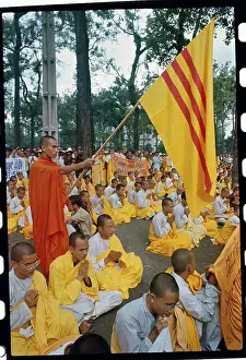 Buddhist Monk Holding a Flag