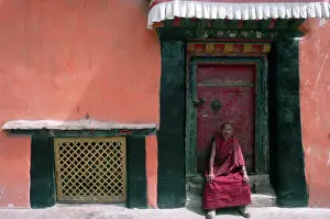 Awning Prints: Buddhist Monk Sitting in Temple Doorway