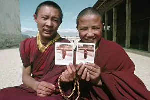 Buddhist Prints: Buddhist Monks Holding Polaroid Photos