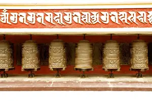 Adorned Prints: Buddhist prayer wheels on the exterior wall of the Swayambhunath Stupa Temple