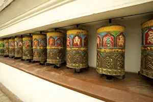 Buddhist prayer wheels on the exterior wall of the Swayambhunath Stupa Temple, also called Monkey Temple, Kathmandu, Nepal, Asia
