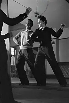 Prints of American choreographer Buddy Bradley (left) training English actress Patricia Burke in the dance routines for her upcoming role in pantomime as principal boy, December 1942 Moments of Everyday Brilliance: Buddy Bradley And Patricia Burke