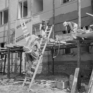 Builders Working on Scaffold