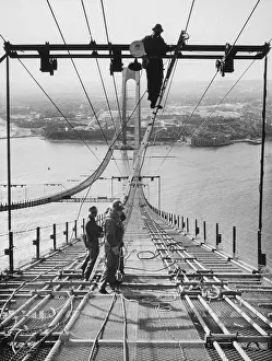 Prints of (Original Caption). New York: Creating an impressive site. Steelworkers string cable high above the waterway between Brooklyn and Staten Island Daredevil Construction Worker Prints: Building the Verrazano-Narrows Bridge