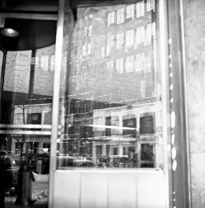 Prints of NEW YORK, NY - JANUARY 1959: An artistic image of buildings reflected in a restaurant window on a snowy day in January 1959 in New York City, New York. (Photo by David Attie/Getty Images) Portraits, Artworks, and Montages from a Visionary Photographer: Buildings Reflected In Restaurant Window in 1950's Midtown NYC