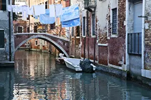 Clothesline Prints: Buildings reflected in the tranquil canal water