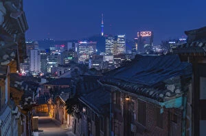 Images Dated 24th March 2016: Bukchon Hanok village at night with Seoul city background