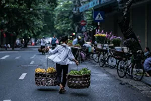 Images Dated 31st August 2014: A burden woman in Hanoi street, Vietnam