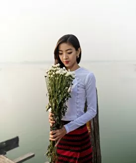 Images Dated 13th March 2016: Burmese girl with flowers In the morning