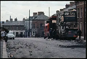 Belfast Prints: Burned Buses in Damaged Street